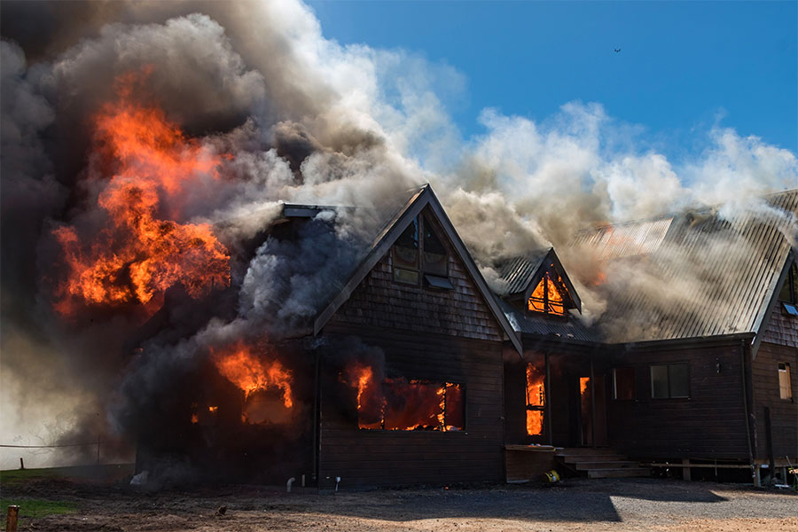 house-fire House on fire with smoke and flames shooting in the air